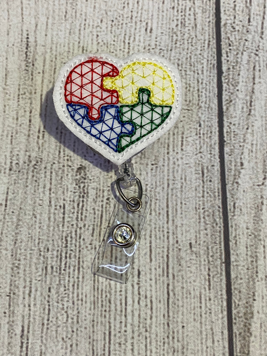 Autism Puzzle Heart Badge Reel